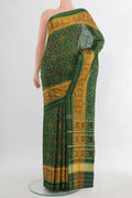 Pure Silk Green Rajkot Patola Saree with Pure Ikat on the body and Ikat Border.  displayed on a mannequin