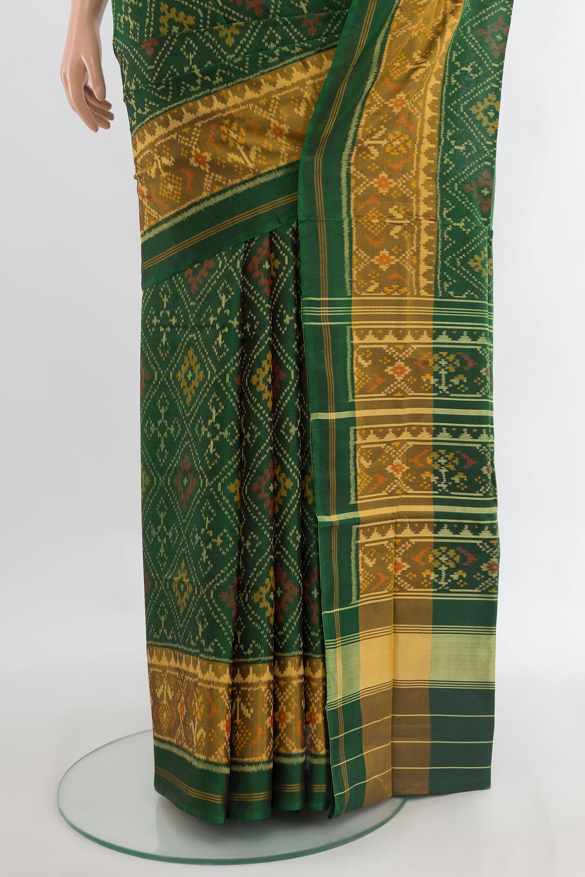 Pleats and pallu of Pure Silk Green Rajkot Patola Saree with Pure Ikat on the body and Ikat Border. 