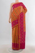 Pure Silk Mustard Rajkot Patola Saree with Pure Ikat on the body and Ikat Border.  displayed on a mannequin