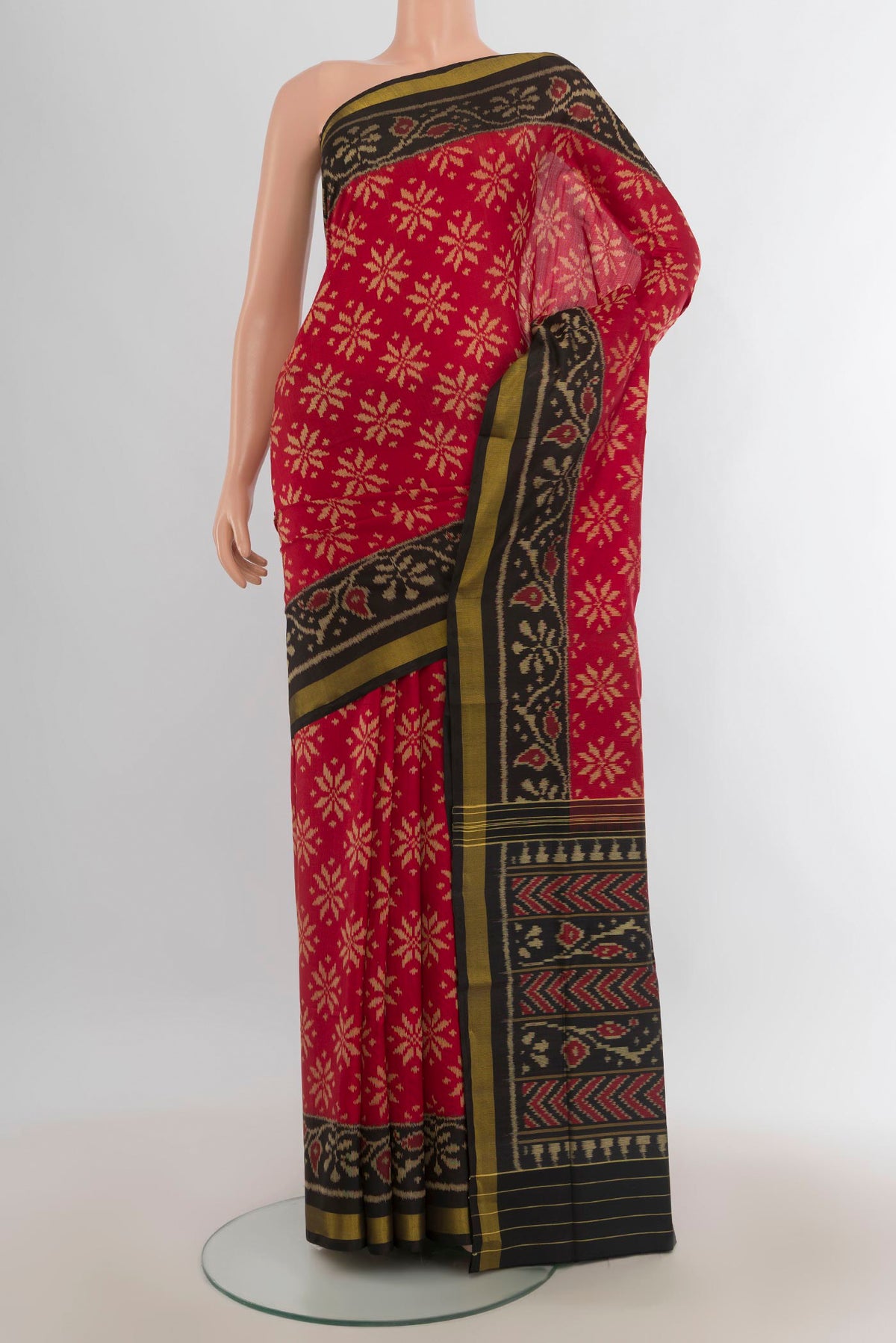 Pure Silk Multi Color Rajkot Patola Saree with Ikat Print on the body and Silk Border.  displayed on a mannequin