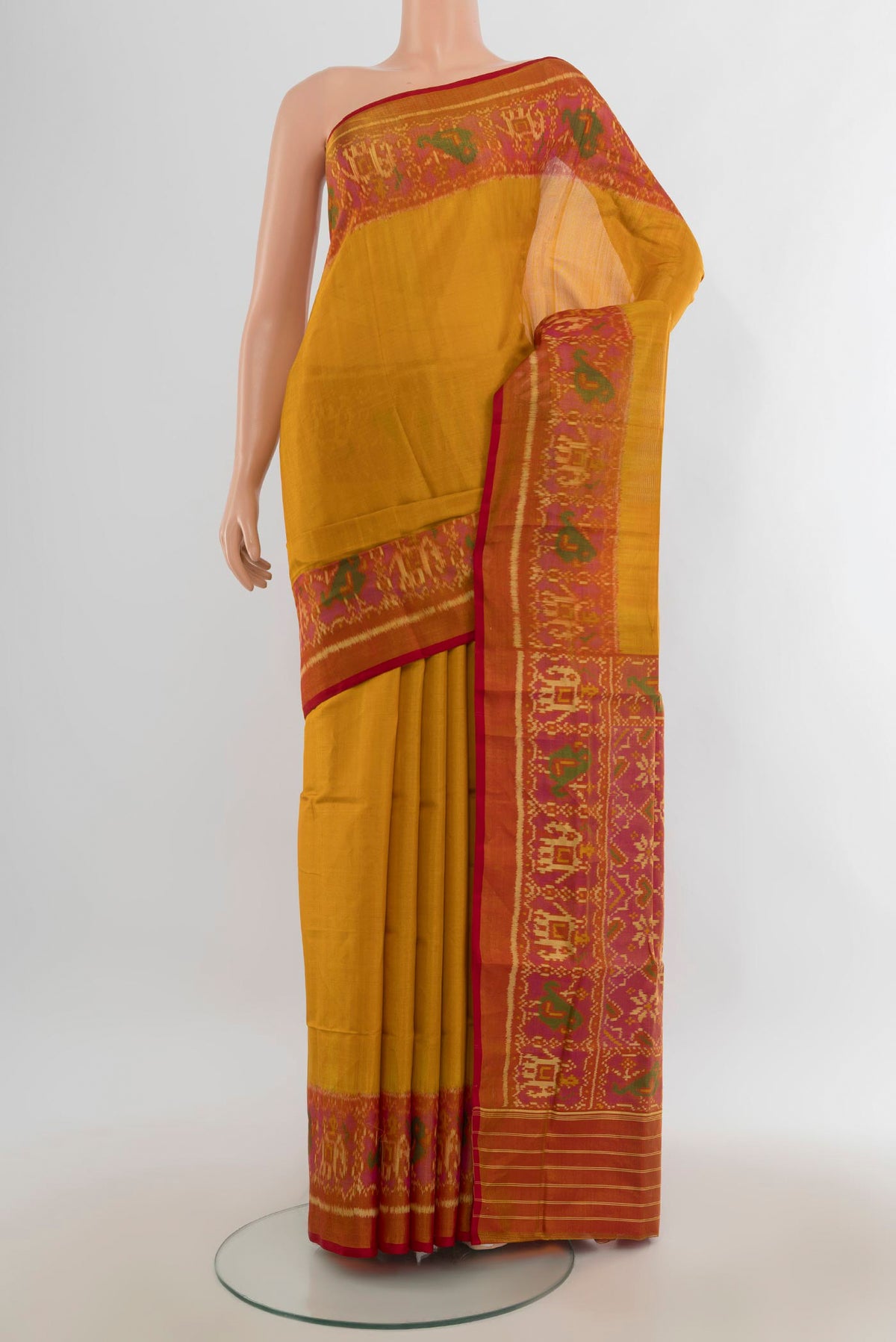 Pure Silk Multi Color Rajkot Patola Saree with Ikat Print on the body and Silk Border.  displayed on a mannequin