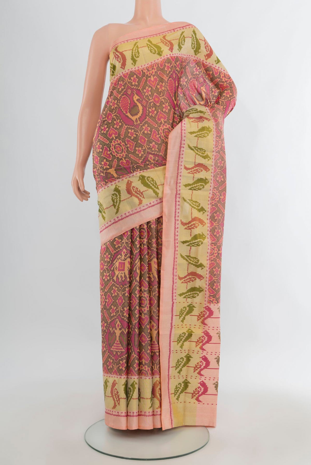 Pure Silk Multi Color Rajkot Patola Saree with Pure Ikat on the body and Ikat Border.  displayed on a mannequin