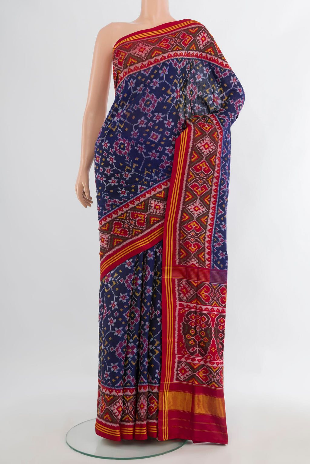 Pure Silk Navy Blue Rajkot Patola Saree with Pure Ikat on the body and Ikat Border.  displayed on a mannequin