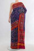 Pure Silk Navy Blue Rajkot Patola Saree with Pure Ikat on the body and Ikat Border.  displayed on a mannequin