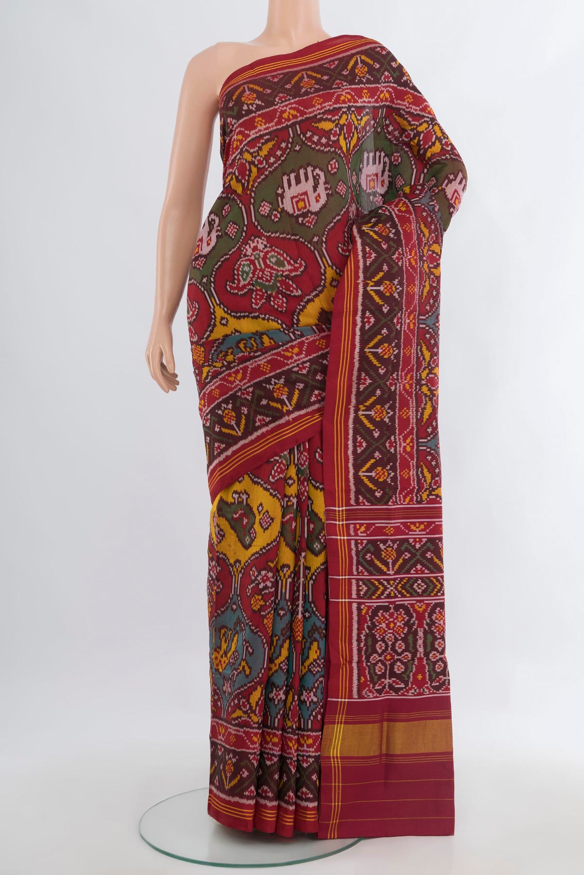 Pure Silk Multi Color Rajkot Patola Saree with Pure Ikat on the body and Ikat Border.  displayed on a mannequin