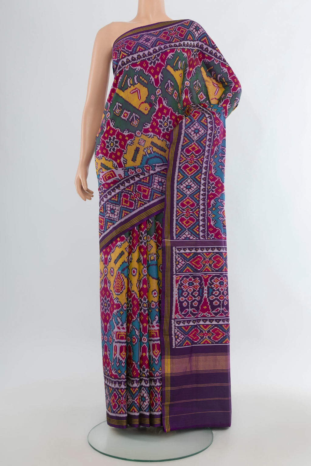 Pure Silk Multi Color Rajkot Patola Saree with Pure Ikat on the body and Ikat Border.  displayed on a mannequin
