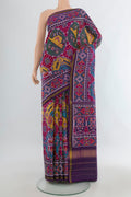 Pure Silk Multi Color Rajkot Patola Saree with Pure Ikat on the body and Ikat Border.  displayed on a mannequin