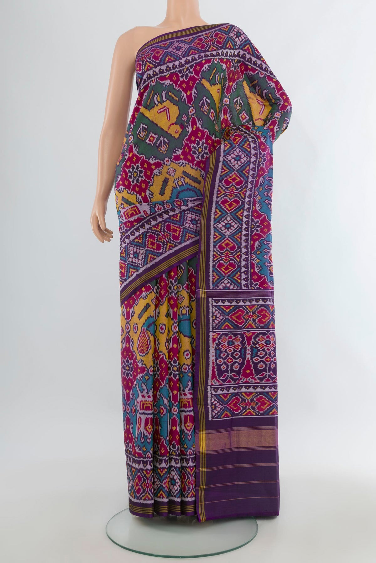Pure Silk Multi Color Rajkot Patola Saree with Pure Ikat on the body and Ikat Border.  displayed on a mannequin