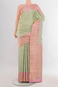 Pure Silk Light Green Kanchipuram Saree with Zari Butta on the body and Fancy Border.  displayed on a mannequin
