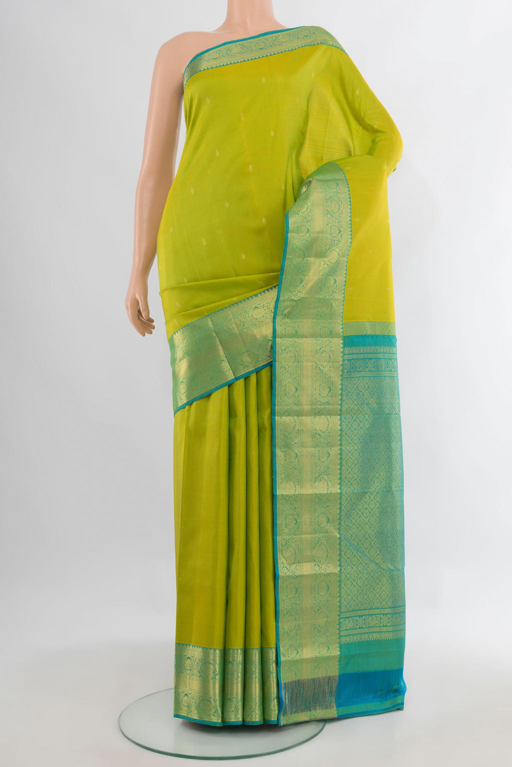 Pure Silk Parrot Green Kanchipuram Saree with Zari Butta on the body and Zari Border.  displayed on a mannequin