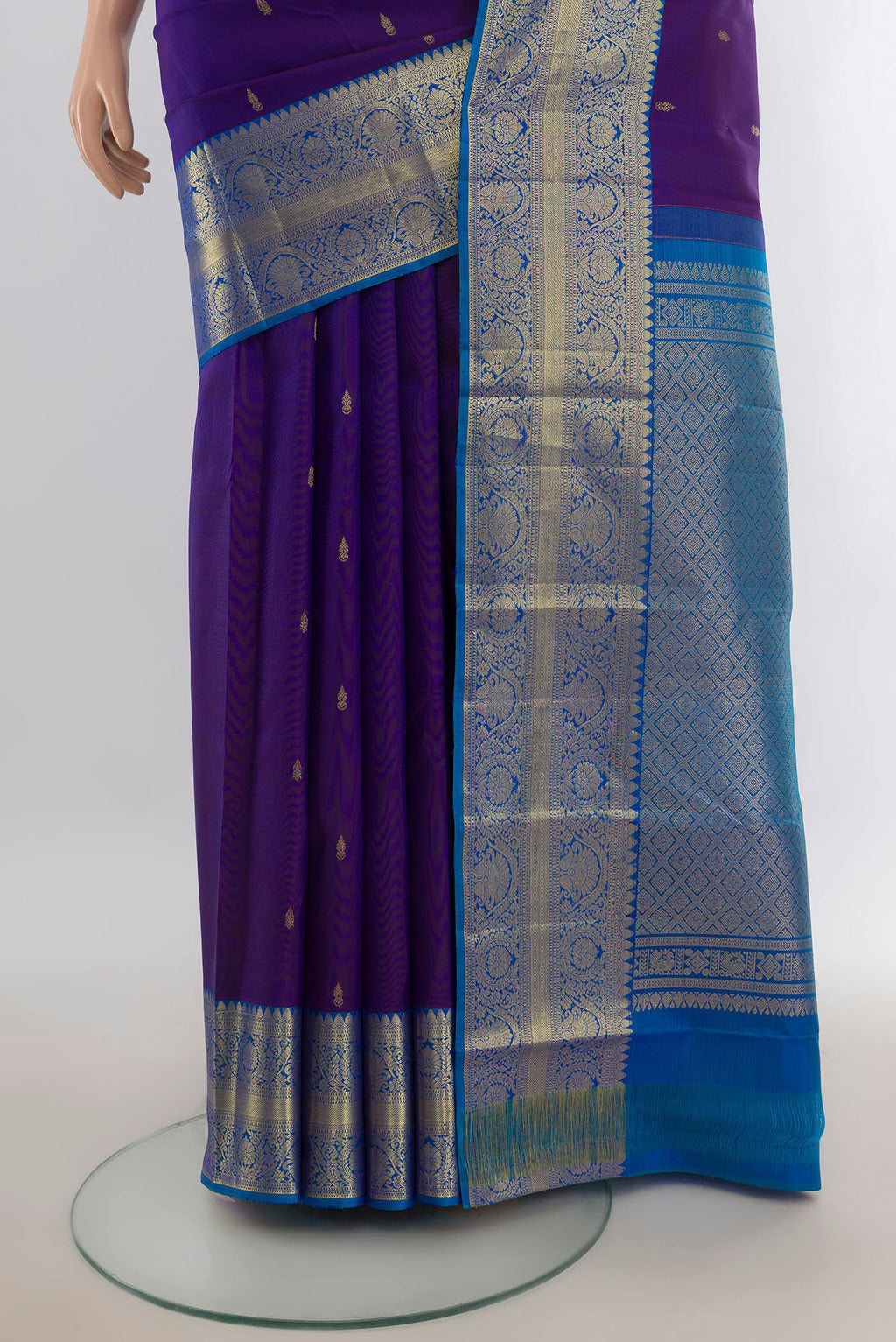 Pleats and pallu of Pure Silk Violet Kanchipuram Saree with Zari Butta on the body and Silk Border. 