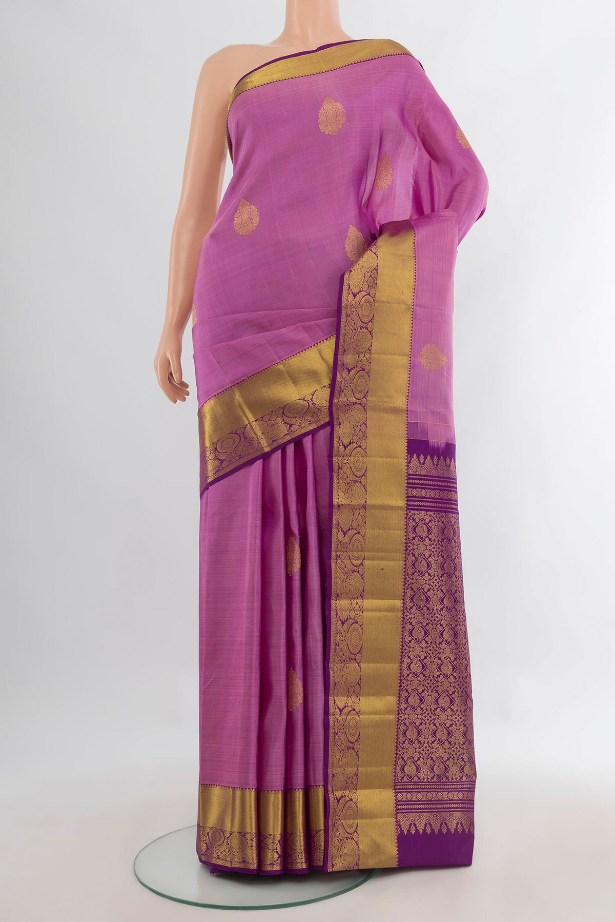Pure Silk Pink Kanchipuram Saree with Zari Butta on the body and Zari Border.  displayed on a mannequin