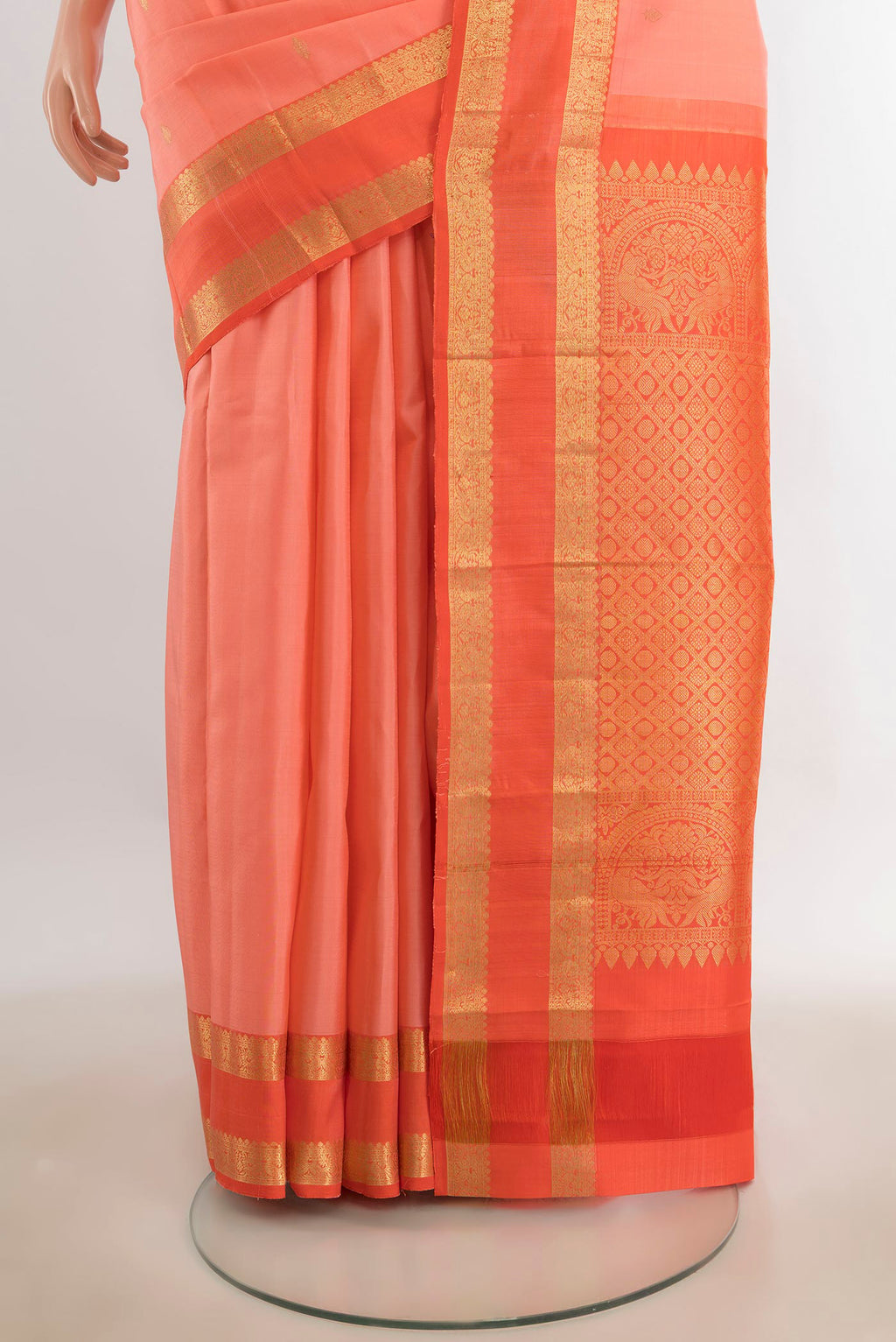 Pleats and pallu of Pure Silk Rose Gold Kanchipuram Saree with Zari Butta on the body and Silk Border. 