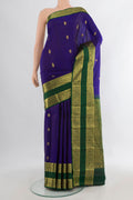 Pure Silk Dark Blue Kanchipuram Saree with Zari Butta on the body and Zari Border.  displayed on a mannequin