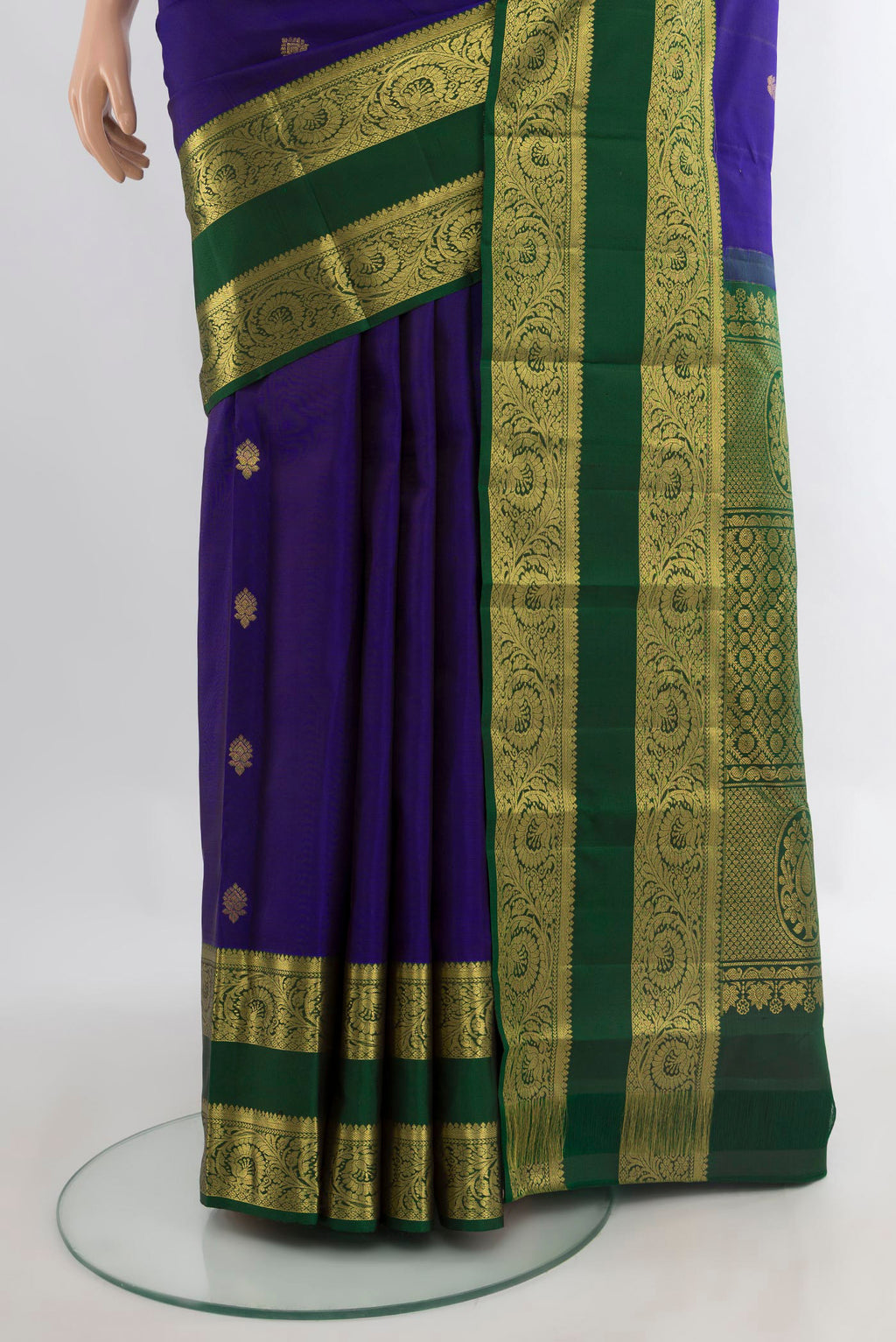 Pleats and pallu of Pure Silk Dark Blue Kanchipuram Saree with Zari Butta on the body and Zari Border. 