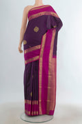 Pure Silk Violet Kanchipuram Saree with Zari Butta on the body and Silk Border.  displayed on a mannequin