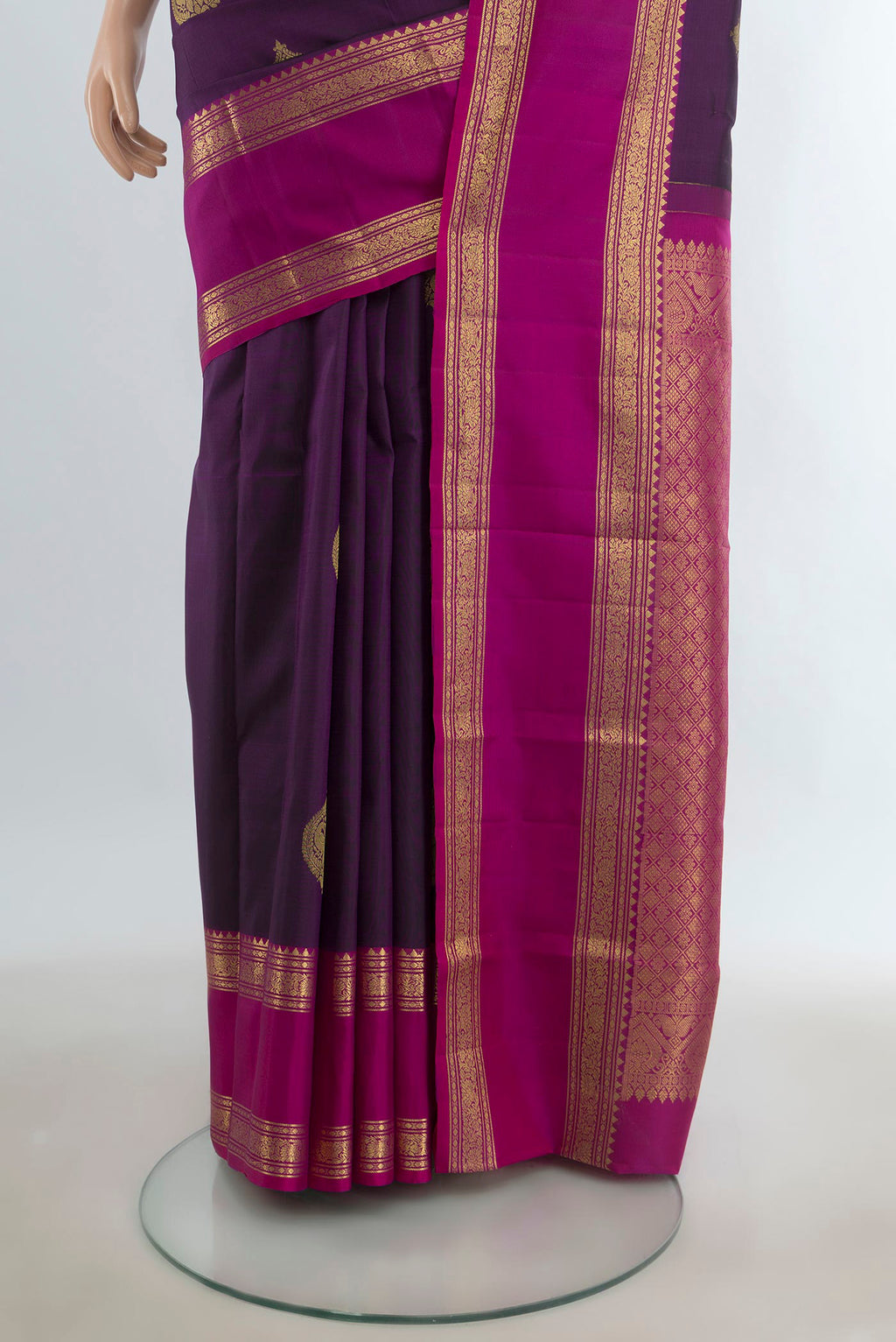 Pleats and pallu of Pure Silk Violet Kanchipuram Saree with Zari Butta on the body and Silk Border. 