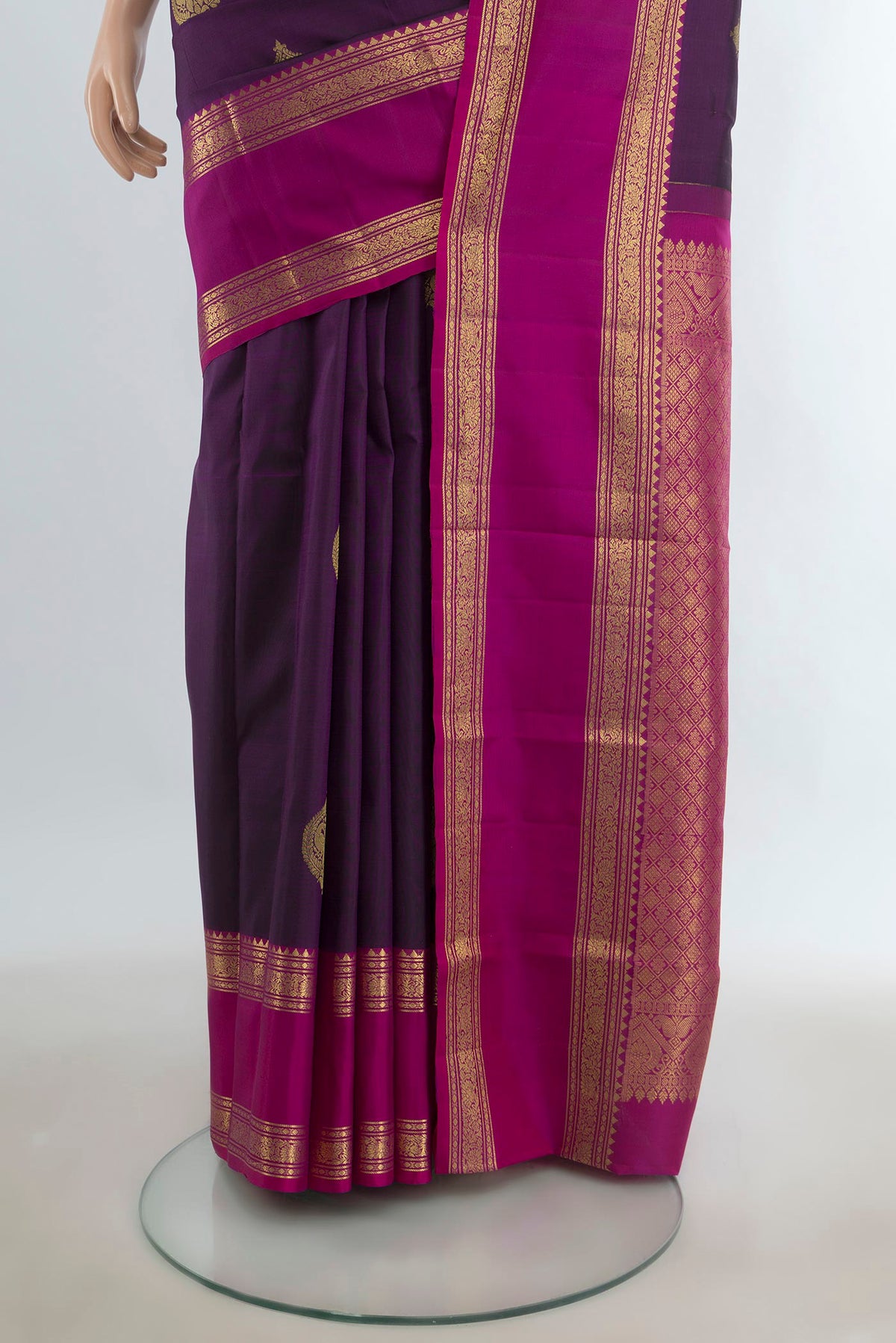 Pleats and pallu of Pure Silk Violet Kanchipuram Saree with Zari Butta on the body and Silk Border. 