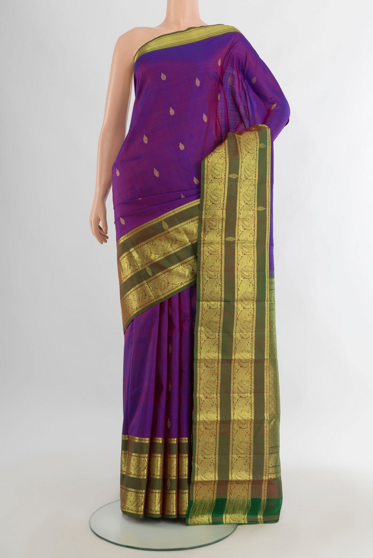 Pure Silk Purple Kanchipuram Saree with Zari Butta on the body and Zari Border.  displayed on a mannequin