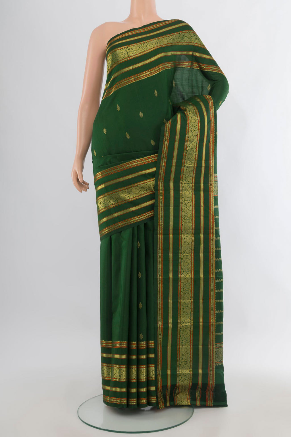 Pure Silk Green Kanchipuram Saree with Zari Butta on the body and Zari Border.  displayed on a mannequin