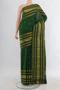 Pure Silk Green Kanchipuram Saree with Zari Butta on the body and Zari Border.  displayed on a mannequin