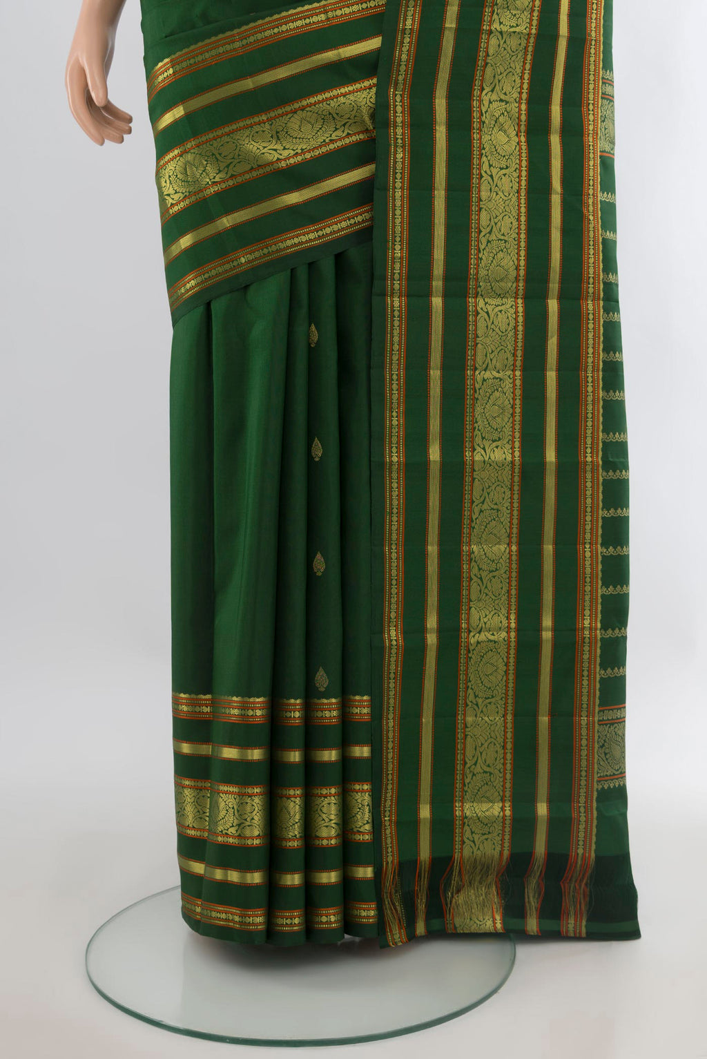 Pleats and pallu of Pure Silk Green Kanchipuram Saree with Zari Butta on the body and Zari Border. 