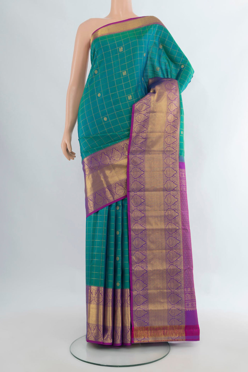 Pure Silk Peacock Blue Dual Tone Kanjivaram Saree with Checked design on the body and Zari Border.  displayed on a mannequin