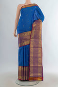 Pure Silk Royal Blue Kanjivaram Saree with Zari Butta on the body and Zari Border.  displayed on a mannequin