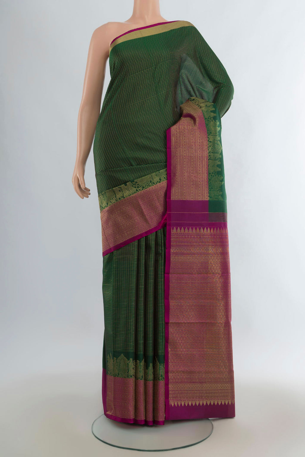 Pure Silk Green Kanjivaram Saree with Checked design on the body and Fancy Border.  displayed on a mannequin
