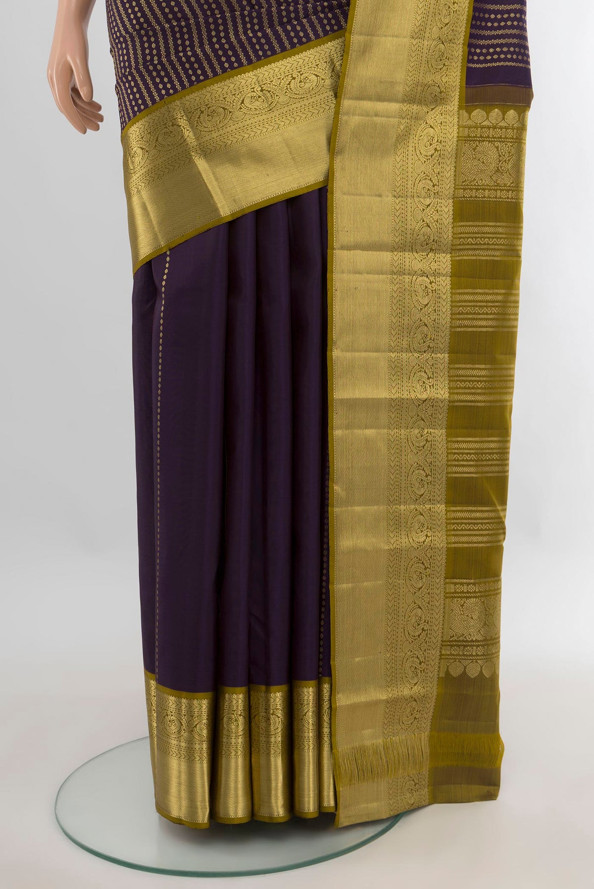 Pleats and pallu of Pure Silk Violet Kanjivaram Saree with Stripes on the body and Zari Border. 