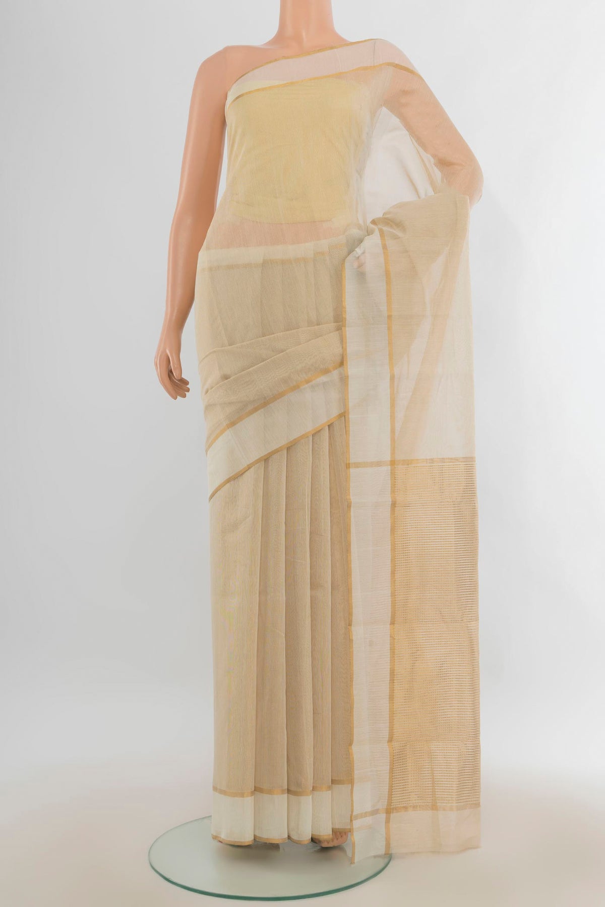 Golden Chanderi Cotton Saree with Zari Butta on the body and Silk Border.  displayed on a mannequin