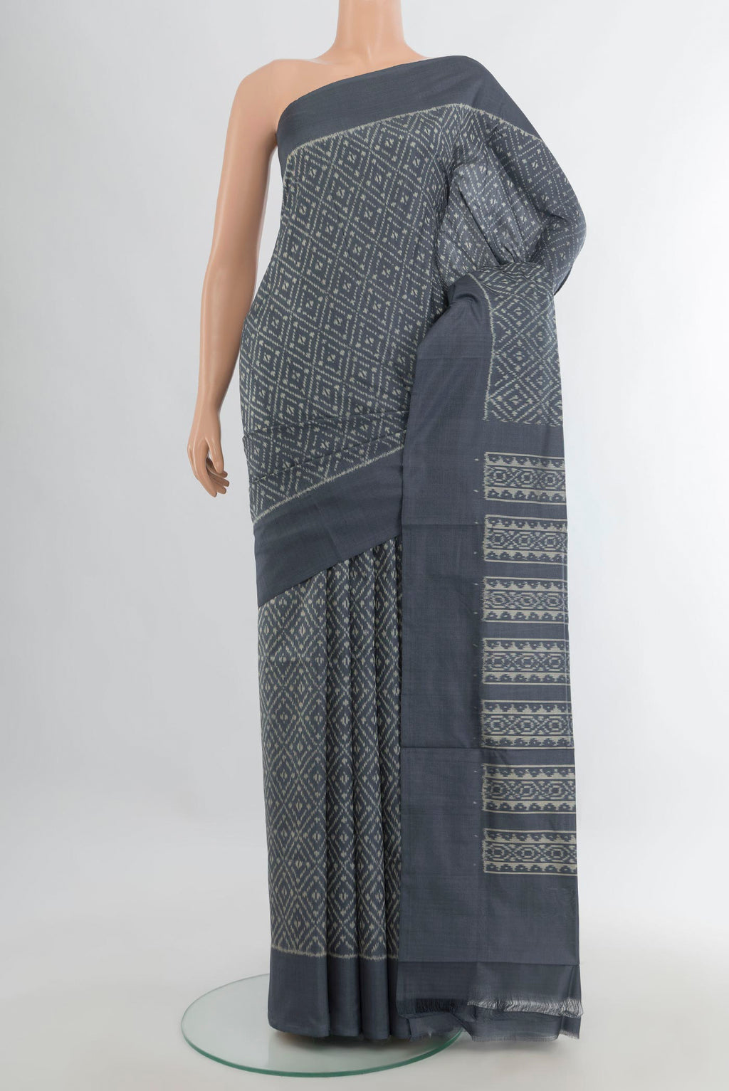 Pure Silk Davys Grey Pochampally Saree with Ikat Print on the body and Silk Border.  displayed on a mannequin