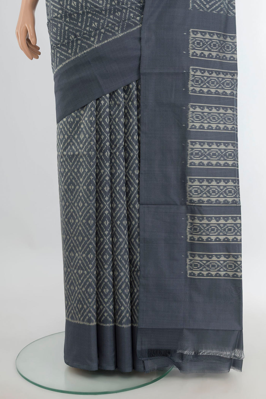 Pleats and pallu of Pure Silk Davys Grey Pochampally Saree with Ikat Print on the body and Silk Border. 
