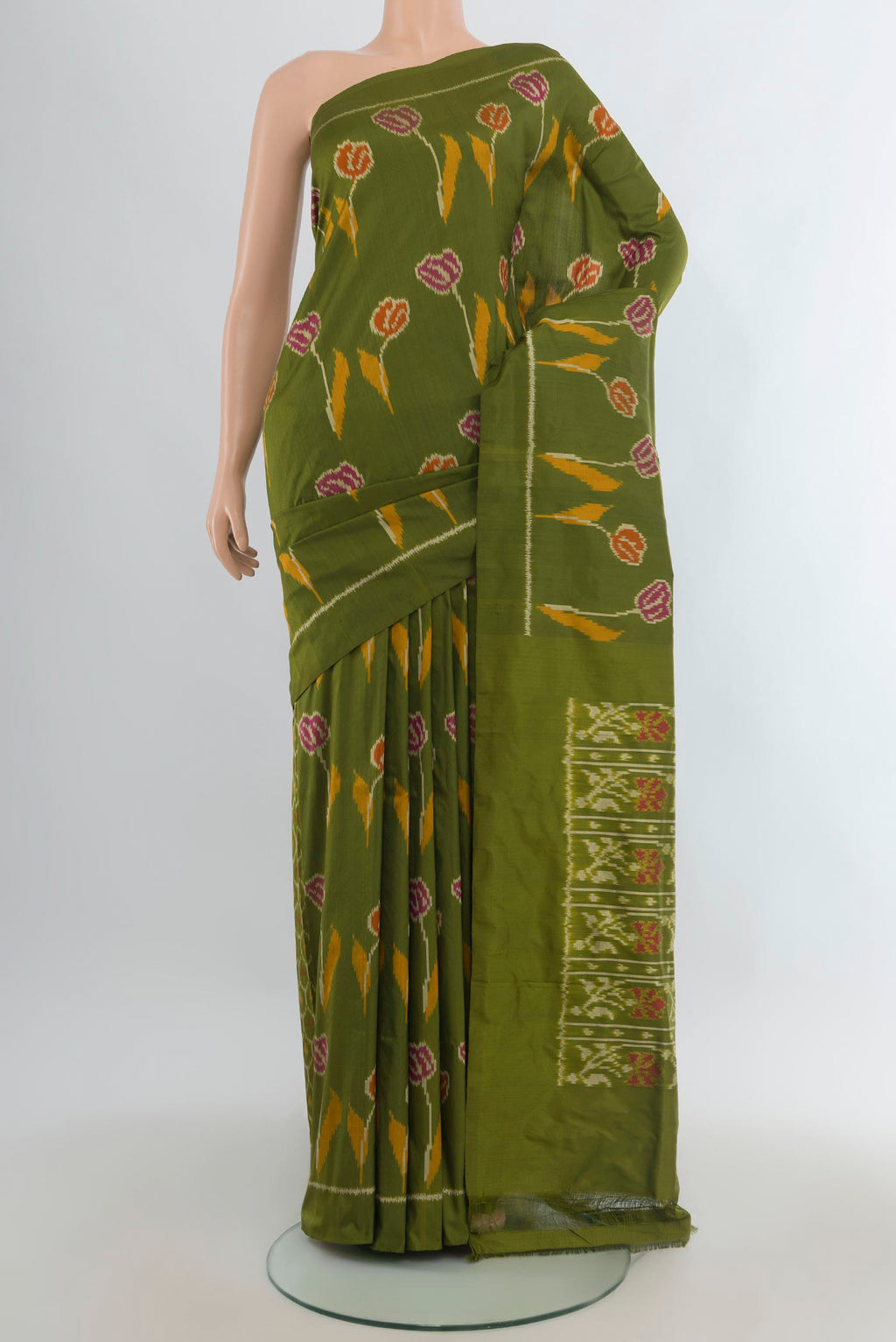 Pure Silk Green Pochampally Saree with Pure Ikat on the body and Plain Border.  displayed on a mannequin