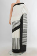 Pure Silk Off White Rajkot Patola Saree with Ikat Print on the body and Silk Border.  displayed on a mannequin