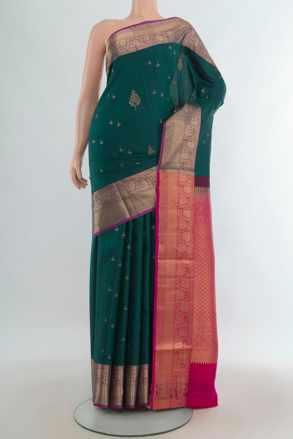 Pure Silk Green Soft Saree with Zari Butta on the body and Zari Border.  displayed on a mannequin