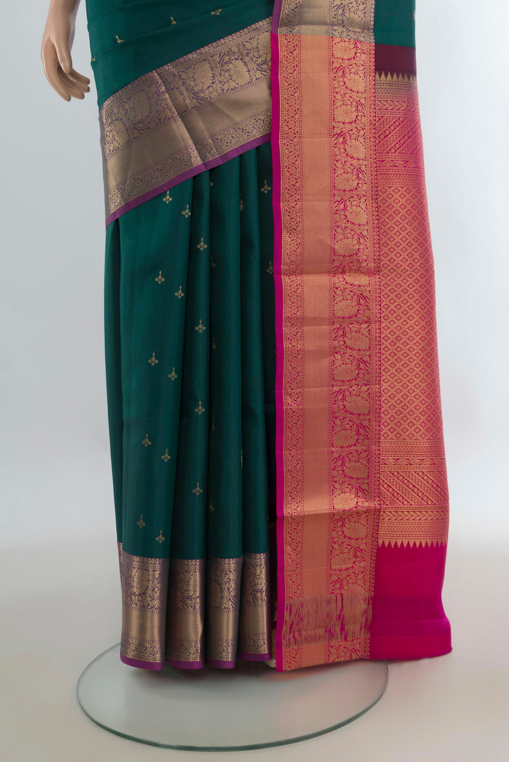 Pleats and pallu of Pure Silk Green Soft Saree with Zari Butta on the body and Zari Border. 