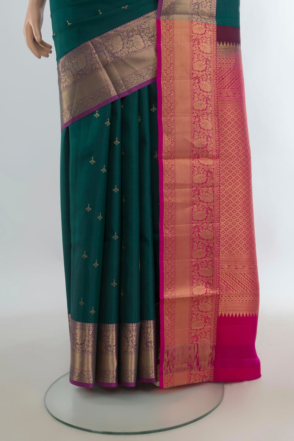 Pleats and pallu of Pure Silk Green Soft Saree with Zari Butta on the body and Zari Border. 