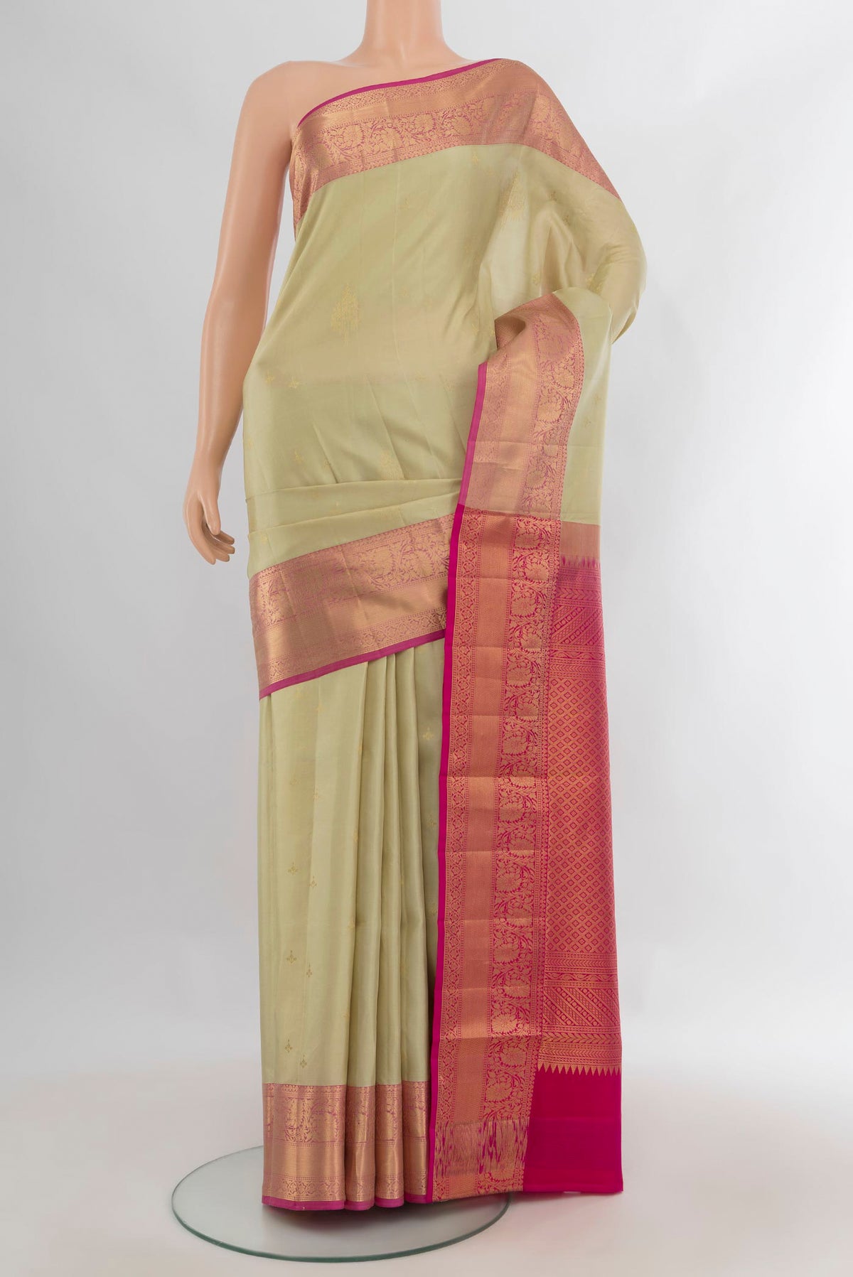 Pure Silk Beige Soft Saree with Zari Butta on the body and Zari Border.  displayed on a mannequin