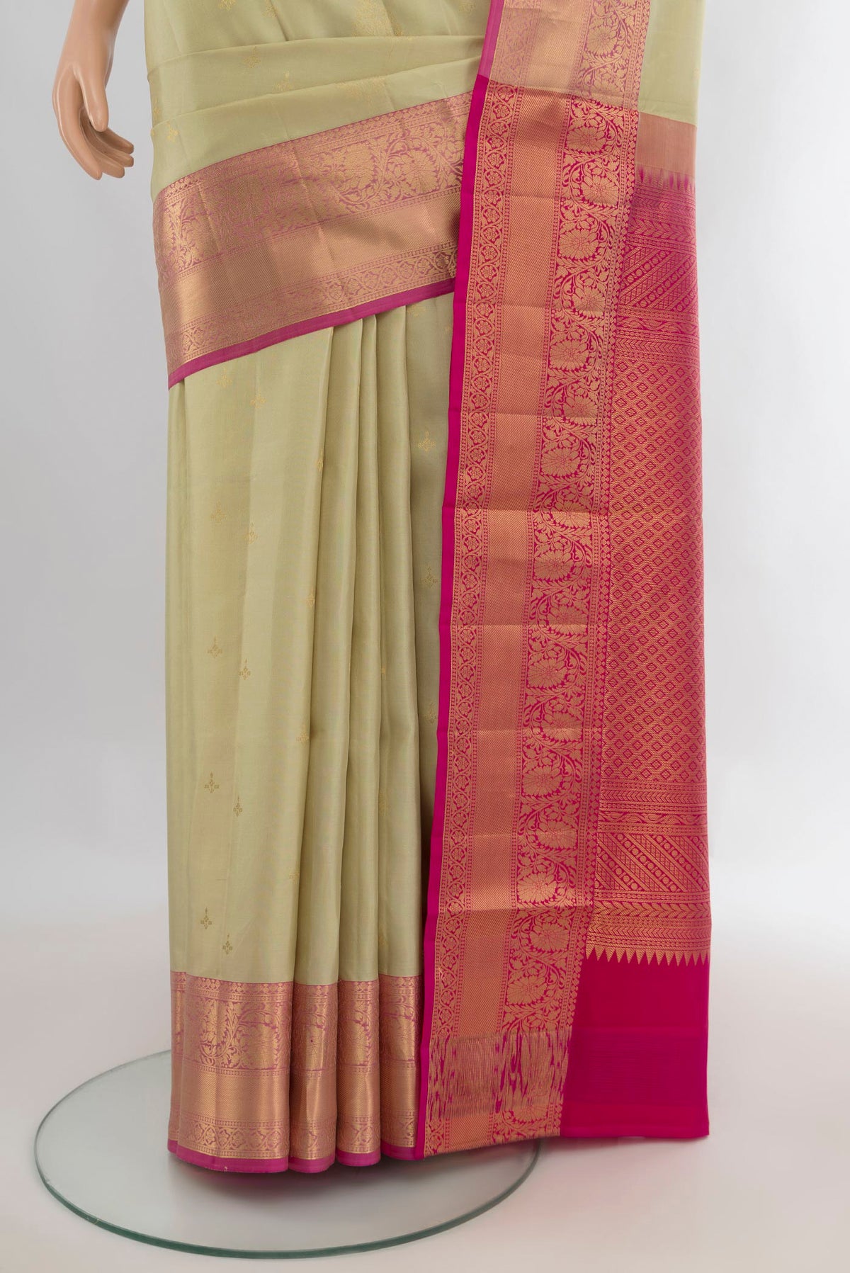 Pleats and pallu of Pure Silk Beige Soft Saree with Zari Butta on the body and Zari Border. 