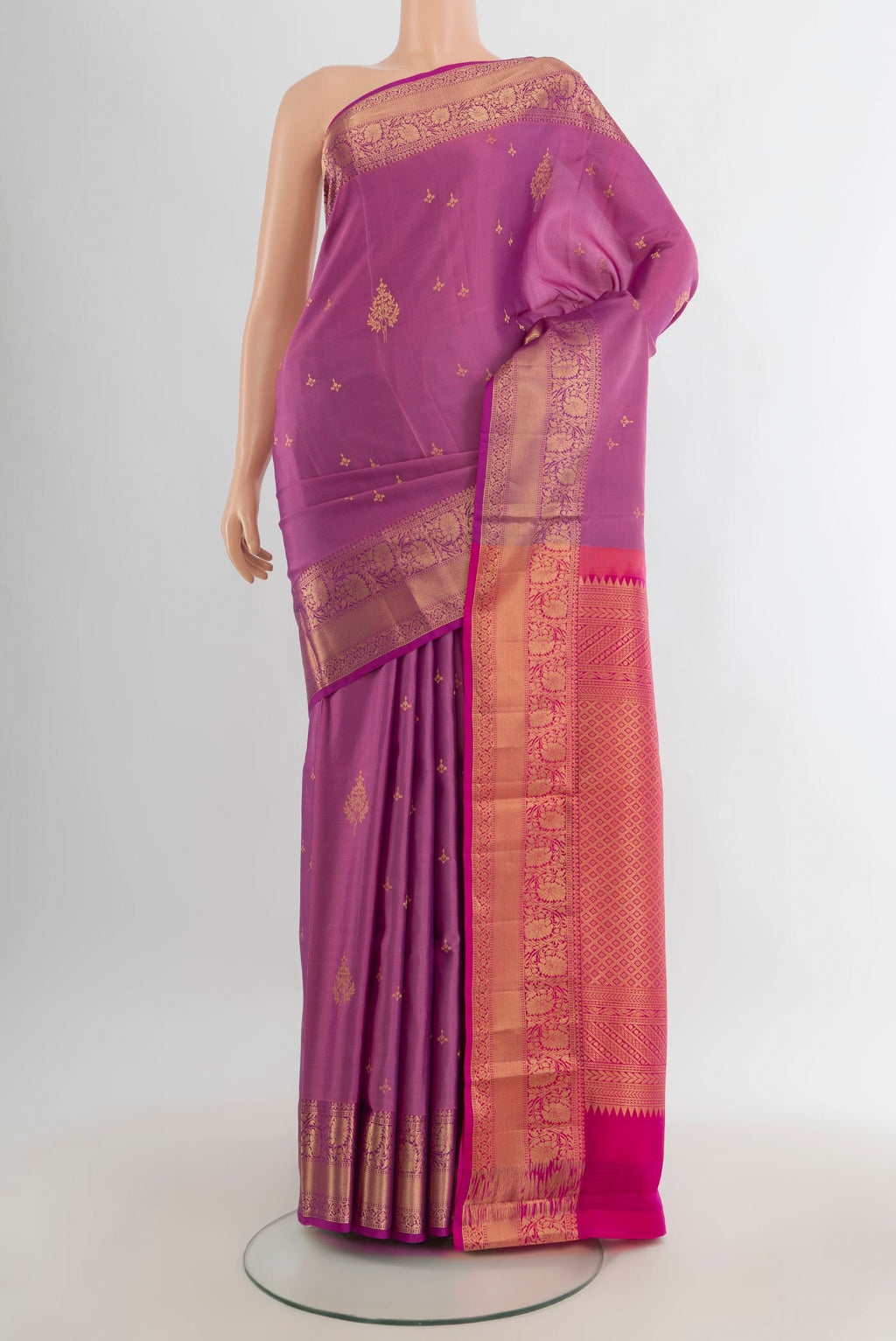 Pure Silk Mauve Soft Saree with Zari Butta on the body and Zari Border.  displayed on a mannequin