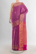 Pure Silk Mauve Soft Saree with Zari Butta on the body and Zari Border.  displayed on a mannequin