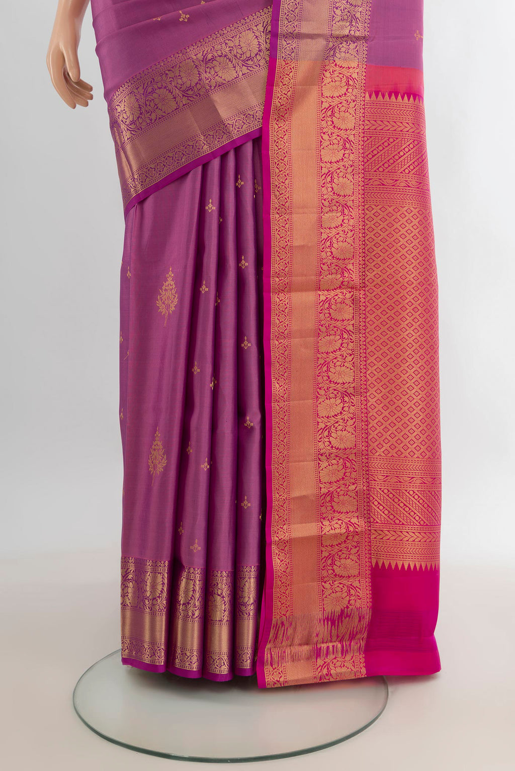 Pleats and pallu of Pure Silk Mauve Soft Saree with Zari Butta on the body and Zari Border. 