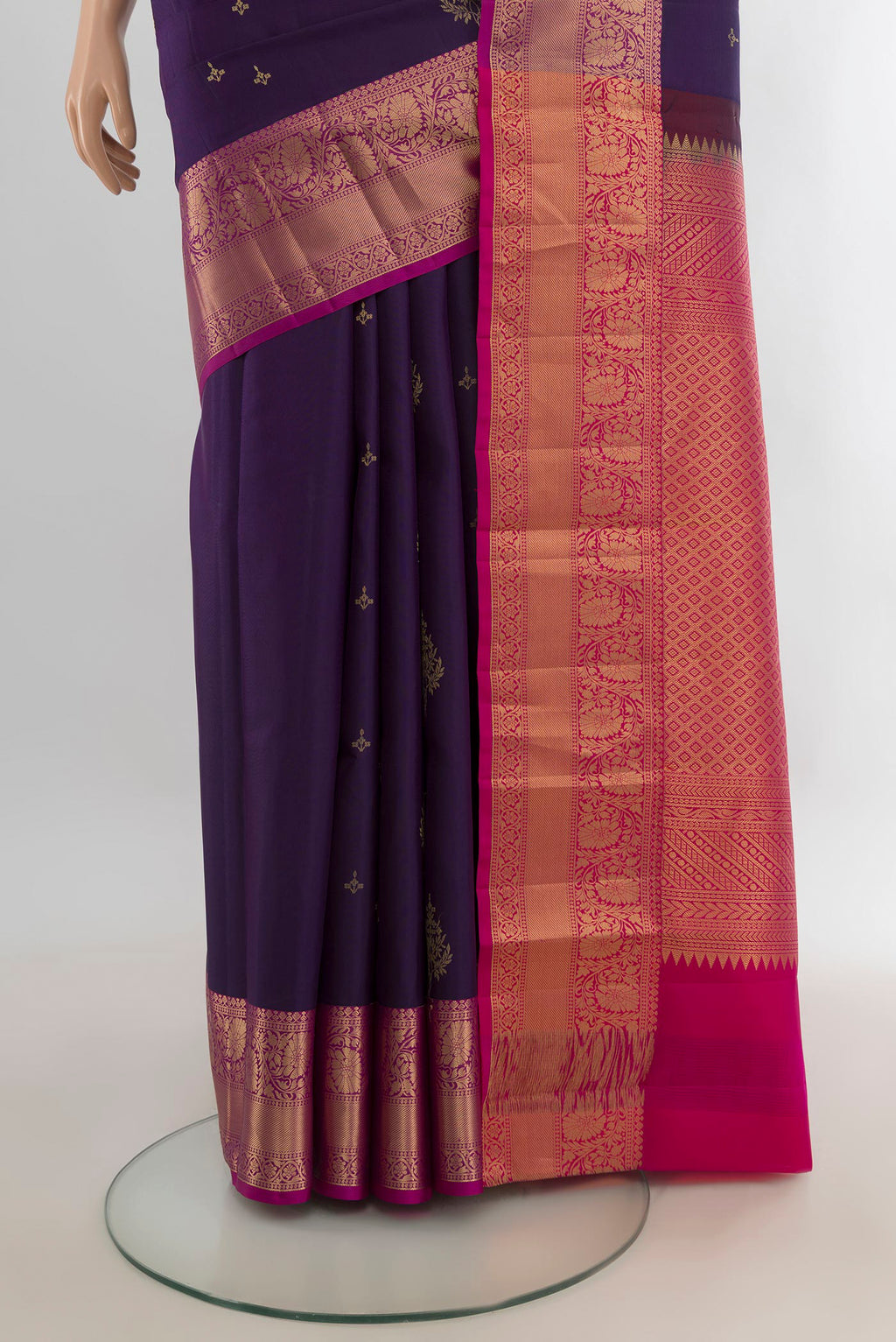 Pleats and pallu of Pure Silk Violet Soft Saree with Zari Butta on the body and Zari Border. 