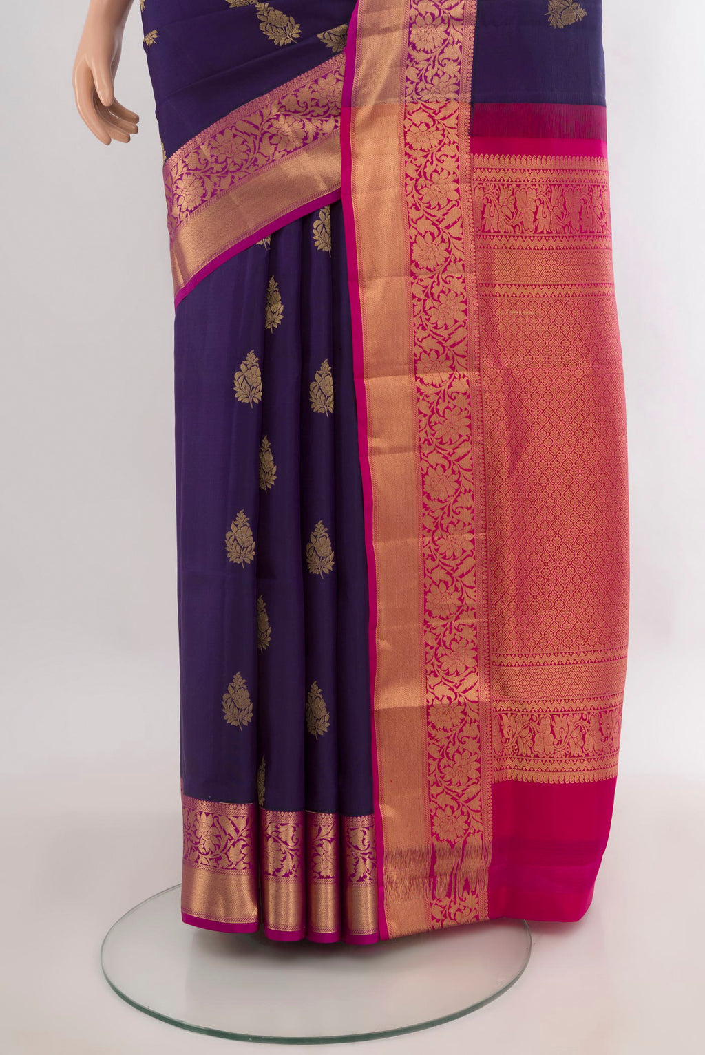 Pleats and pallu of Pure Silk Navy Blue Soft Saree with Zari Butta on the body and Zari Border. 