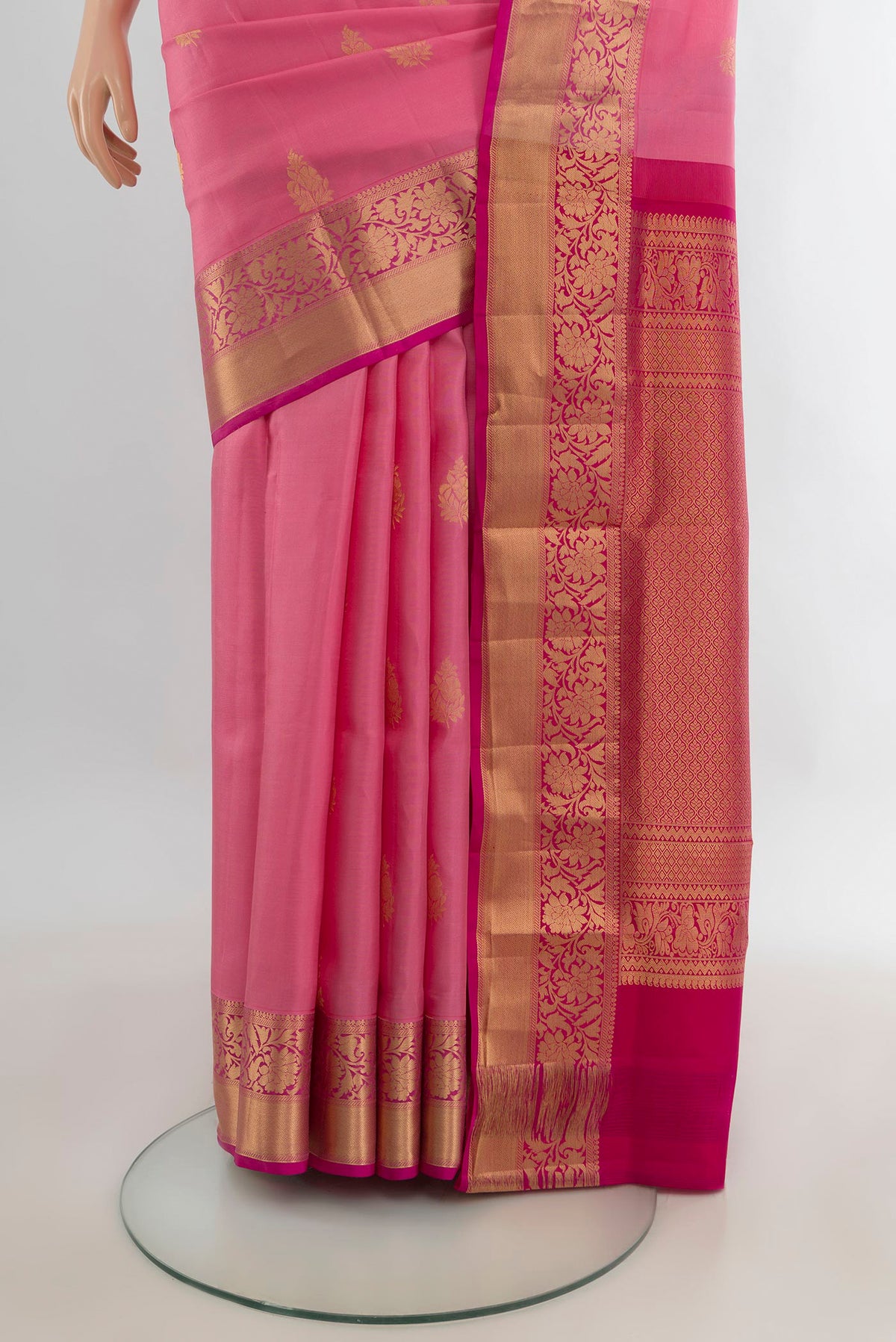 Pleats and pallu of Pure Silk Rose pink Soft Saree with Zari Butta on the body and Zari Border. 
