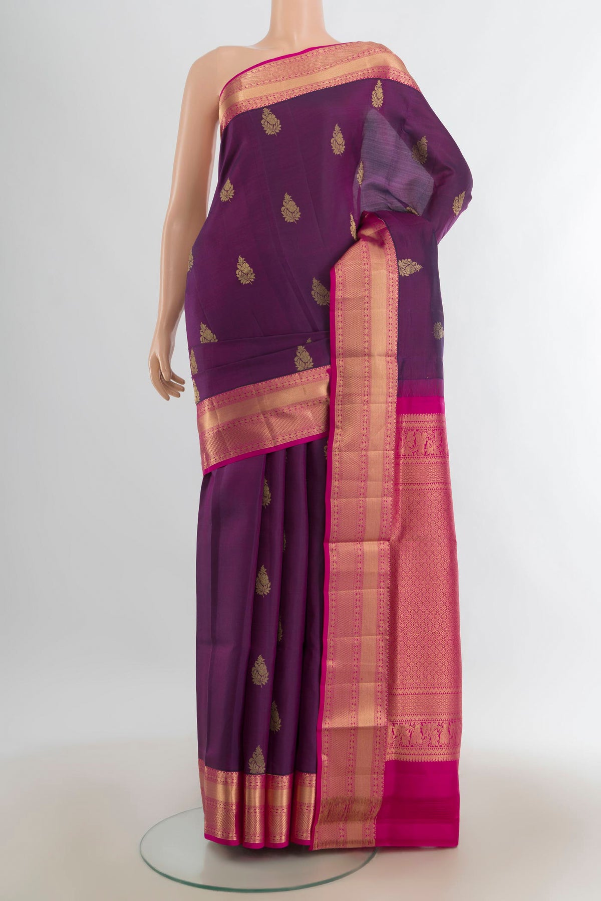 Pure Silk Purple Soft Saree with Zari Butta on the body and Silk Border.  displayed on a mannequin