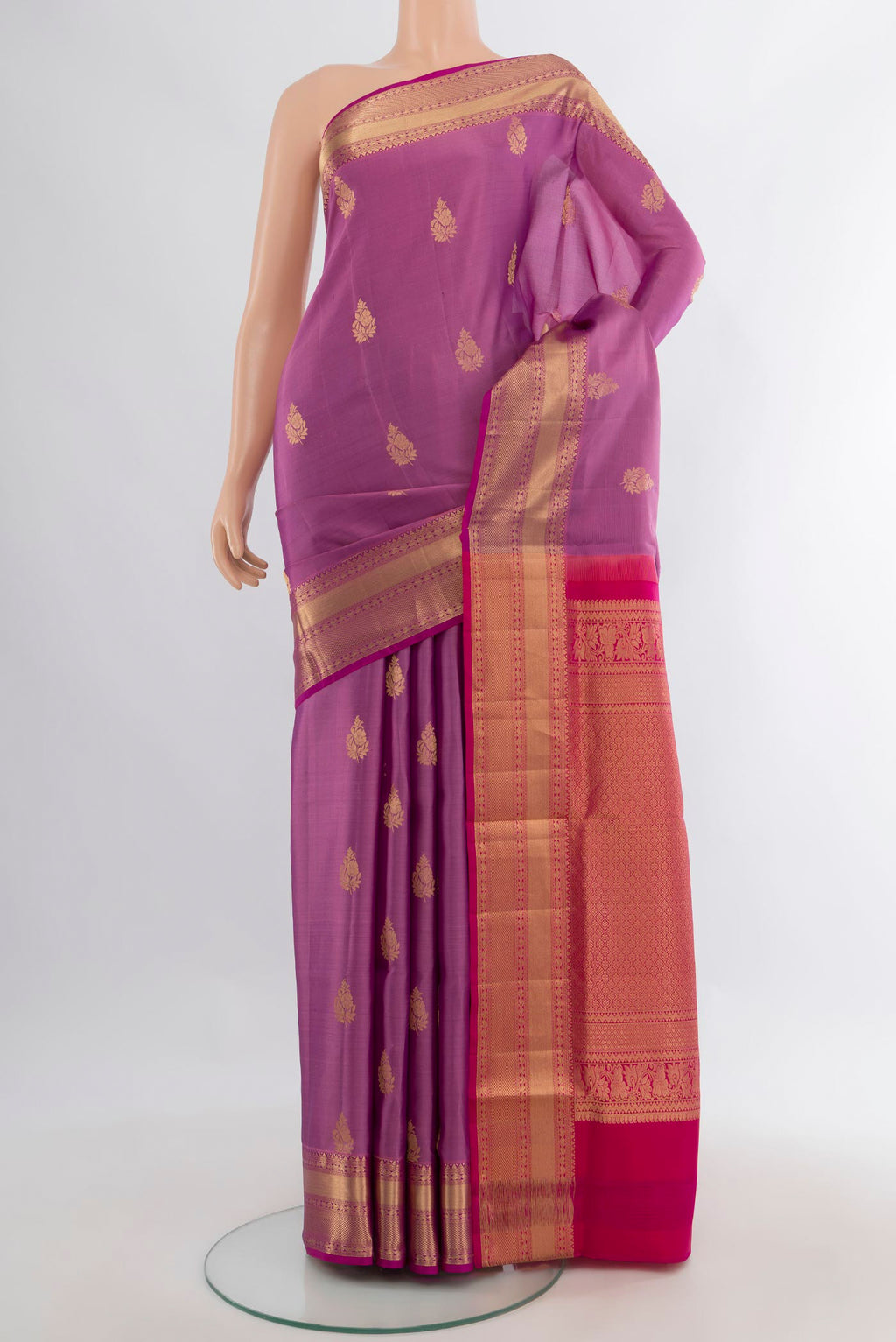 Pure Silk Lavender Soft Saree with Zari Butta on the body and Zari Border.  displayed on a mannequin
