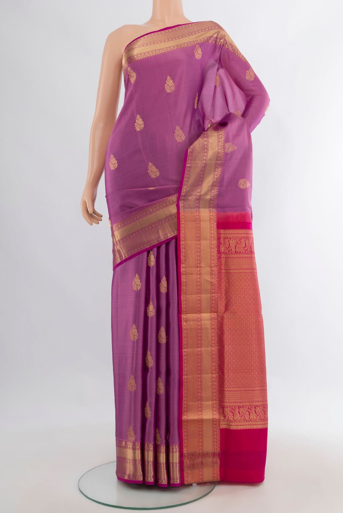 Pure Silk Lavender Soft Saree with Zari Butta on the body and Zari Border.  displayed on a mannequin