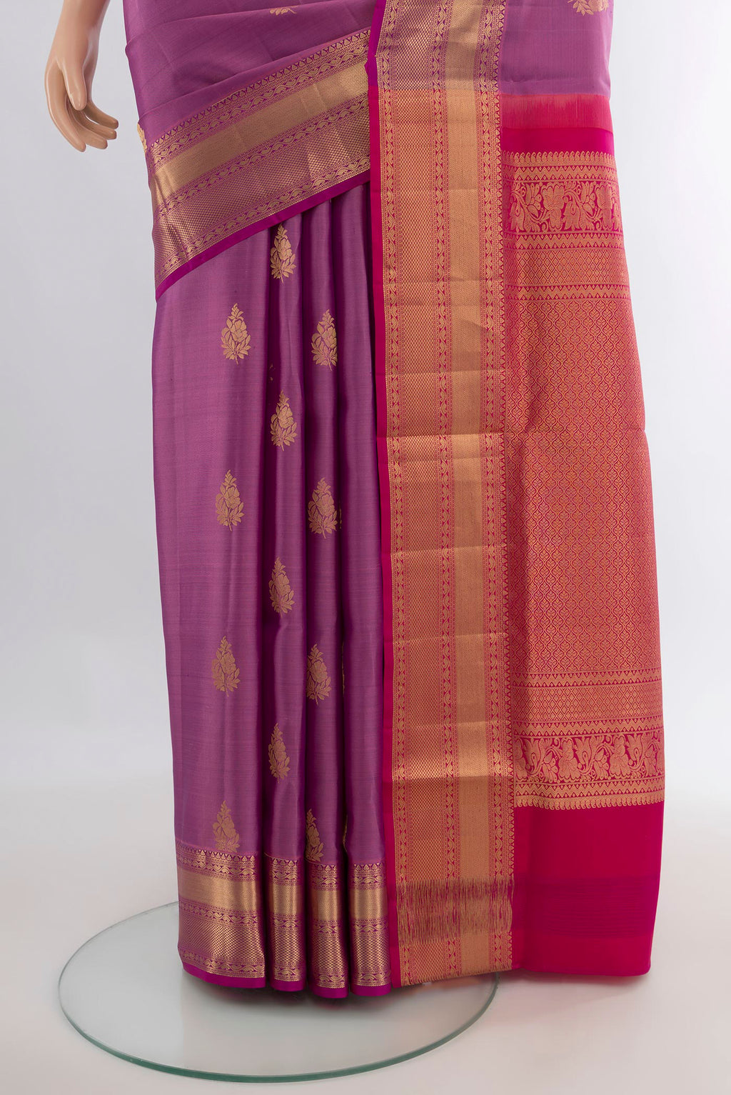 Pleats and pallu of Pure Silk Lavender Soft Saree with Zari Butta on the body and Zari Border. 